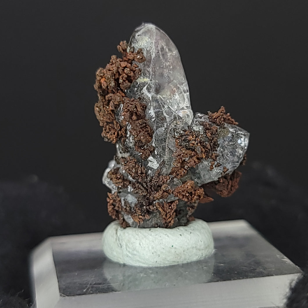 Calcite with Dendritic Native Copper from Mexico. 2.97g - UV Reactive Calcite with Dendritic Native Copper Inclusions. Locale: Zacatecas, Mexico. Weight: 2.97 grams. Dimensions: 21 x 14mm - The Crystal Connoisseurs