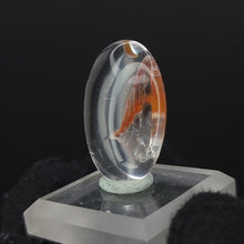Load image into Gallery viewer, Brookite in Quartz. Cabochon, Oval. 24ct. - The Crystal Connoisseurs
