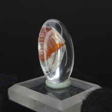 Load image into Gallery viewer, Brookite in Quartz. Cabochon, Oval. 24ct. - The Crystal Connoisseurs
