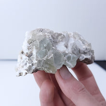 Load image into Gallery viewer, Quartz on Fluorite. 191g - The Crystal Connoisseurs
