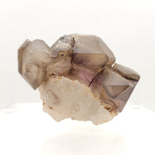 Load image into Gallery viewer, Smoky Ametrine on Quartz - The Crystal Connoisseurs
