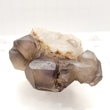 Load image into Gallery viewer, Smoky Ametrine on Quartz - The Crystal Connoisseurs

